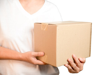 A parcel cardboard parcel box in a delivery woman person hands isolated on white background. Delivery service concept. Asian Young girl holding a package is a delivery business entrepreneur.