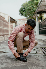 Portrait of a man wearing a batik shirt