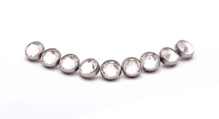 A set of jewelry for piercing on a white background. A set of earrings for the body, nose, navel, tongue, nipples, ears, various beauty jewelry, a set of cosmetological jewelry for piercing.