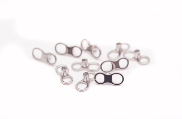 A set of jewelry for piercing on a white background. A set of earrings for the body, nose, navel, tongue, nipples, ears, various beauty jewelry, a set of cosmetological jewelry for piercing.