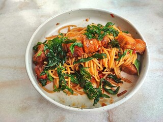 Thai-style spicy spaghetti with basil and crispy pork