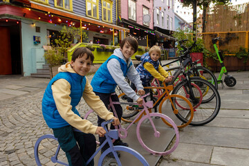Obraz premium Happy family, children and adults, enjoying the colorful city of Stavangen in Southwest Norway in summer