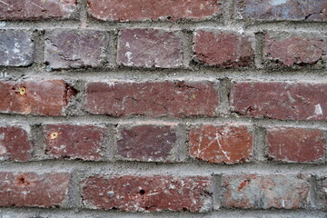 Vieux mur de briques rouges.