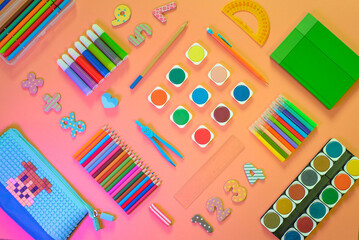 Flat lay with different school supplies on colored background. Copy space. Top view.