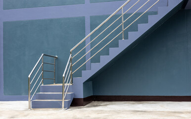 Close-up view of the background of the stairway sideways, the purple-gray wall. - obrazy, fototapety, plakaty