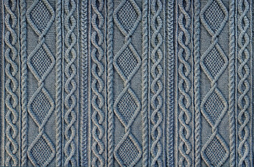 blue  background knitted fabric with a pattern. Knitted Arans close-up