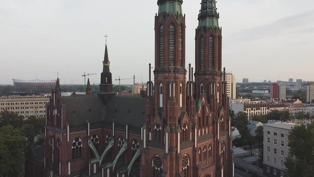 Drone footage of Warsaw, capital of Poland with cathedral of saint florian, traffic, city forest and city skyline with sky scrapers in the background