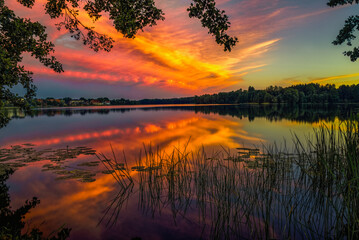 Fototapeta na wymiar Evening beautiful sunset strip and reflection.