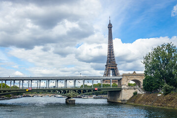 Bir Hakeim bridge and Eiffel Tower seen from a Bateau Mouche tour boat cruising on the Seine river in Paris, France