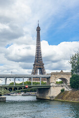 Fototapeta na wymiar Bir Hakeim bridge and Eiffel Tower seen from a Bateau Mouche tour boat cruising on the Seine river in Paris, France