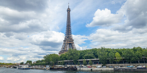 Fototapeta na wymiar Eiffel Tower seen from a Bateau Mouche tour boat cruising on the Seine river in Paris, France