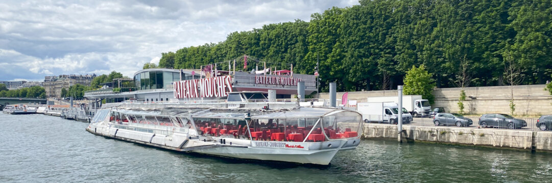 Bateaux Mouches dock seen from a Bateau Mouche tour boat cruising on the Seine river in Paris, France