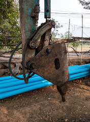 Closeup of the jackhammer and the drilling vehicle.