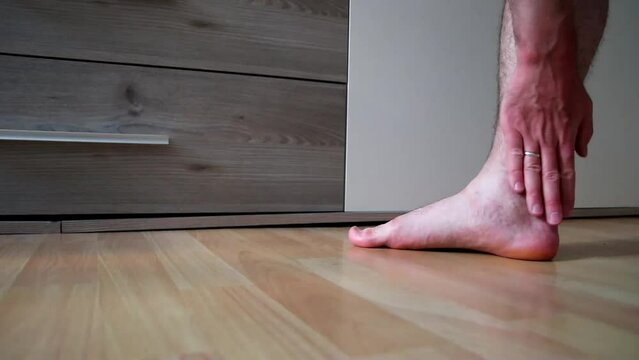 Man with pain after achilles tendon rupture