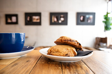 Two cookies and a coffee on a table in a french bar 