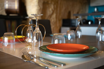 A table with plates and glasses in a french interior