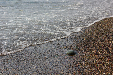 foam of the black sea near the rocky shore