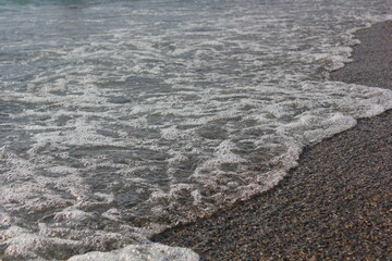 foam of the black sea near the rocky shore