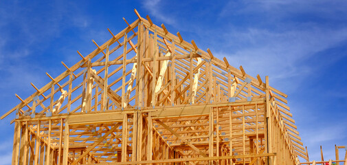 Construction on New Home or Residential Building Wooden Beams and Sky