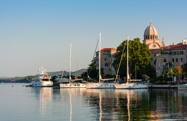 Obraz premium Sibenik, Croatia, a small sea vessel is moored off the coast