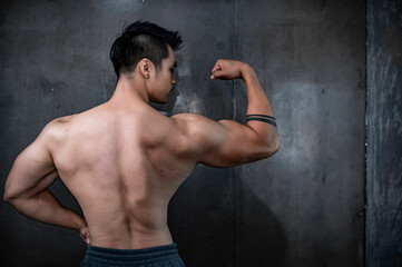 Portrait of asian man big muscle at the gym,Thailand people,Workout for good healthy,Body weight training,Fitness at the gym concept