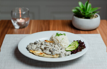 Fried Chicken Breast With Creamy Mushroom Sauce and Rice 