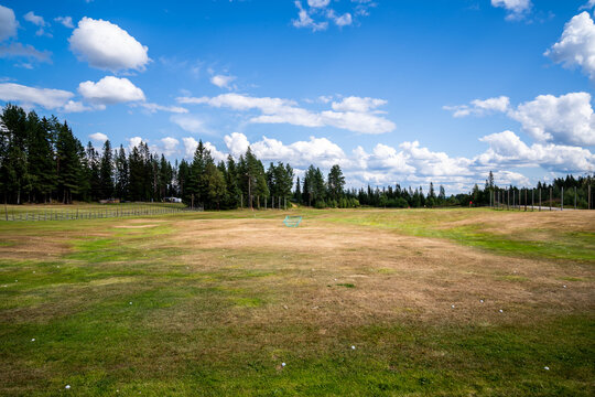 Summer landscape view of a driving range golf fairway for practice in Sweden.