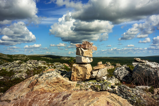 Mountain landscape view with pile of small stones in the foreground and horizon in the background in Vemdalen Sweden.