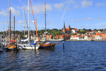 Fototapeta na wymiar The historical port of Flensburg and the St. Marys church and the old town in background, Germany