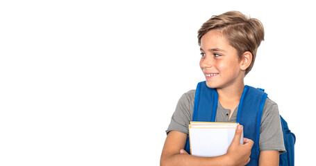 Smiling boy looks at the side with books and backpack isolated on white background © Anna
