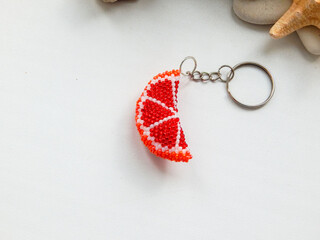 Grapefruit key chain and sea pebble