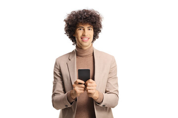 Elegant young man with a curly hair holding a smartphone and looking at camera