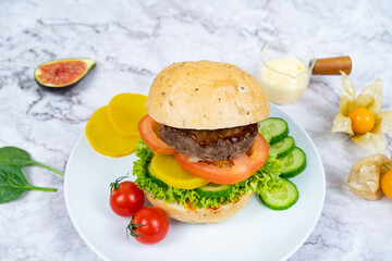 BEEF BURGER with cheese, tomato, cucumber and mayo dip served in a bowl isolated on grey background side view healthy korean food