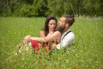 beautiful caucasian couple in love in a meadow