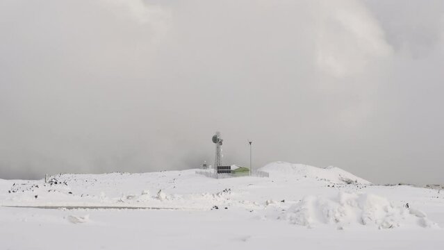 Communication antenna with wind turbine in volcano osorno, chile