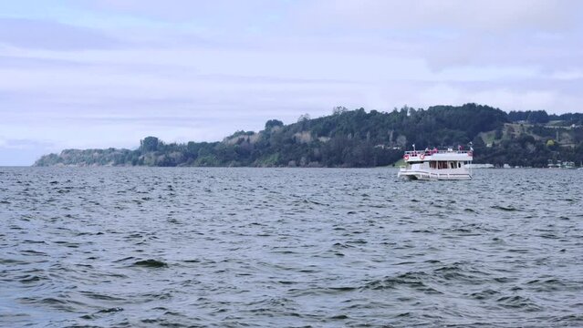 Boat sailing on lake in Frutillar Chile