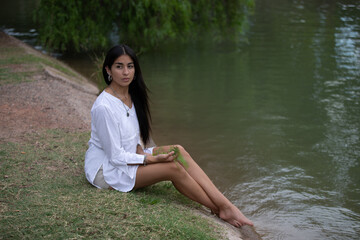 woman in a park by the lake