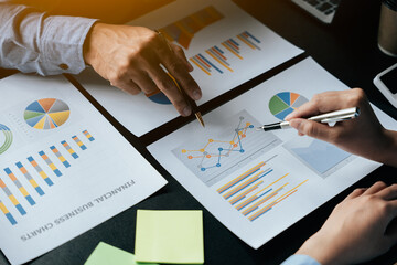Close up of hands are working and brainstorming on paperworks about business financial and...