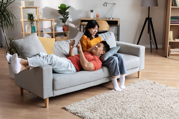 High angle view of beautiful chinese couple relaxing at home
