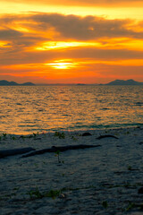 Sunset sky scenery by the coast at Besar Island or Pulau Besar in Mersing, Johor, Malaysia