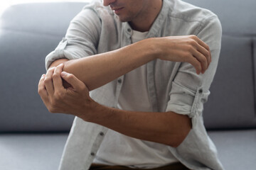 Man's arm pain, human arm anatomy