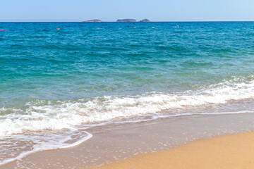 waves of the sea hitting the shore, foamy waves.