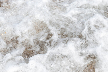 waves of the sea hitting the shore, foamy waves.