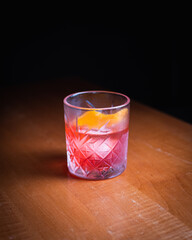 Rose cocktail with orange peel garnish 