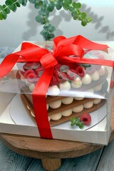 Bento cake in a gift box, on a stand.