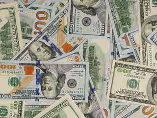 Group of money stack of 100 US dollars banknotes.