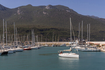 Fototapeta na wymiar Boats moored in the harbor and calm sea.
