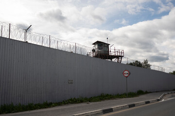 high security fencing used at prison or maximum security venues with watchtower and guards
