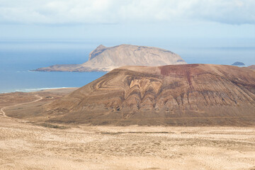 Fototapeta na wymiar View of the Agujas Grandes volcano with the Isla de Montaña Clara in the background