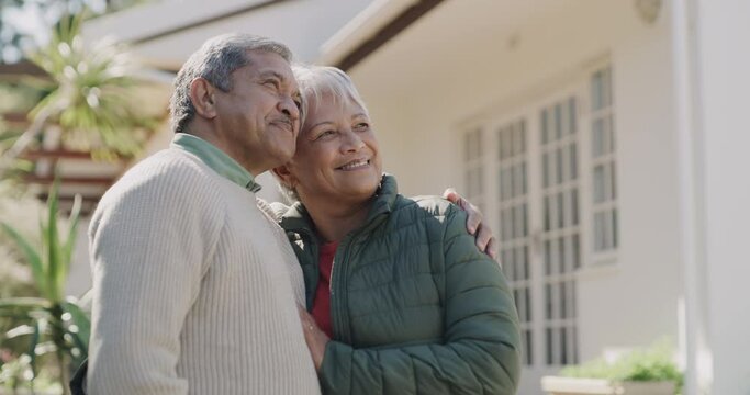 Loving, happy and joyful mature or old lovers with a retirement investment in property. New house, home loan or bank loan approved for a senior couple standing outside their home on a weekend.
